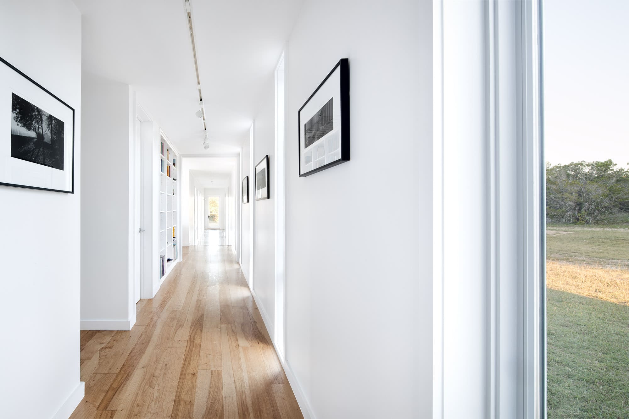 Bright airy hallway of Self-sustaining home in Wimberley Texas