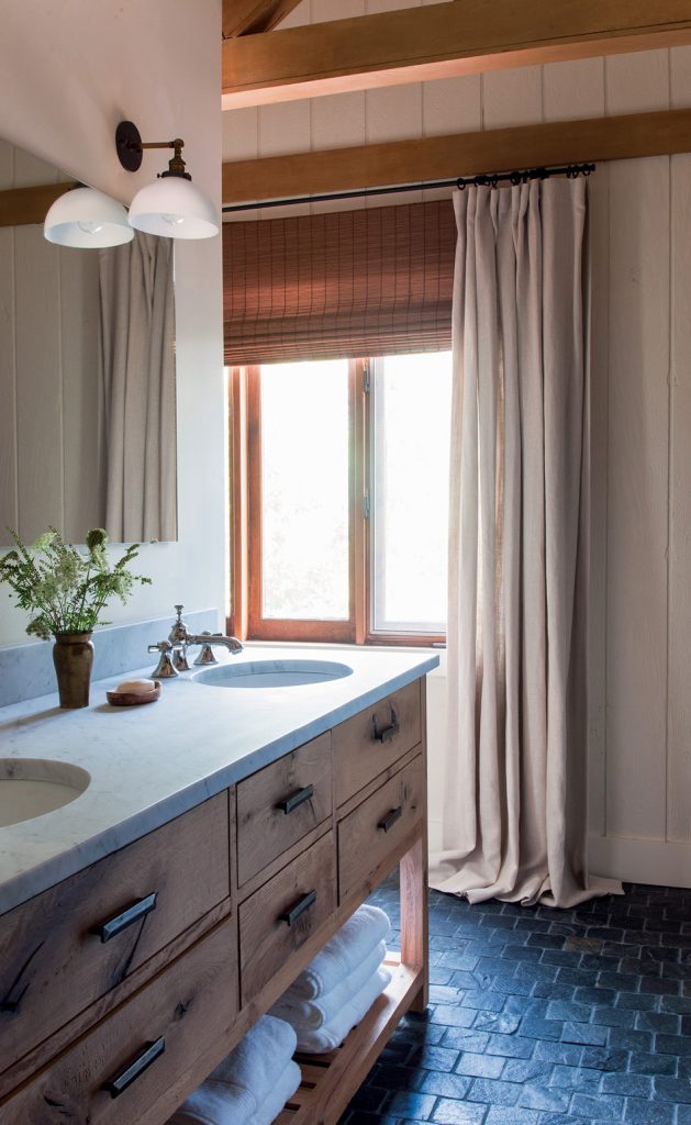 A simple textural bathroom in a mountain home feels quiet and relaxing.