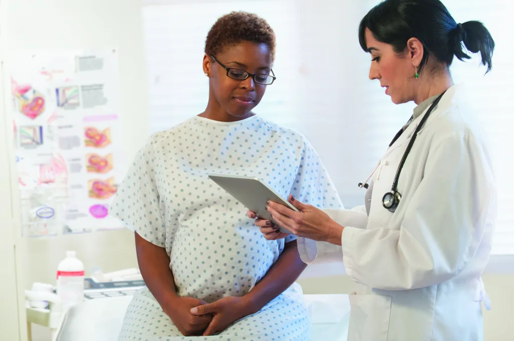Pregnant woman regular check-up with OB-GYN