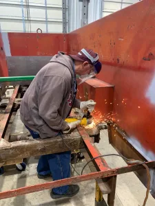 Charles Corporon welding on frame