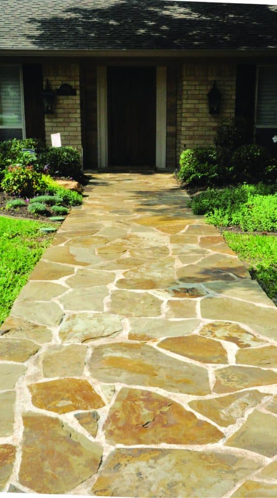 A new walkway draws the eye and beckons guests into the home.