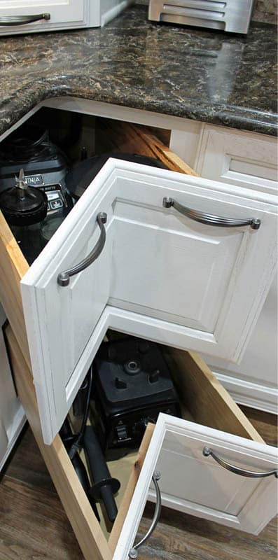 Corner cabinets provide inventive storage space. Photo courtesy Sam Ferris, Tukasa Creations.