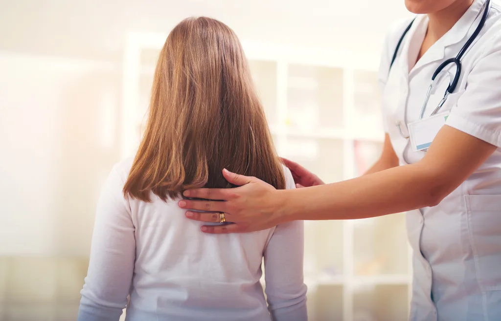 Chiropractor doing adjustment on female patient