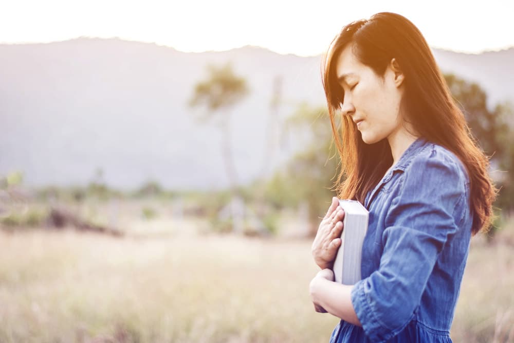 Self Help Spiritual Self Love Self Care religion Woman praying in meadow at sunset with gradient