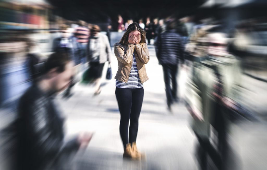 Panic attack in public place Woman having panic disorder in cit