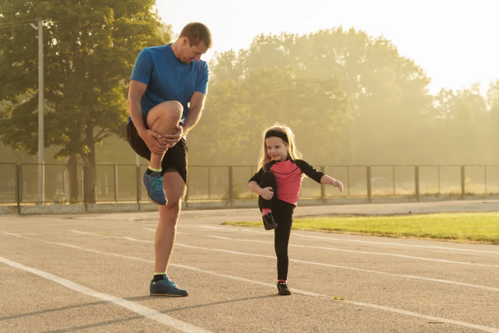 Dad and daughter go in for sports Dad and daughter at the stadium; Inspiring Kids to Get Excited About Physical Activity