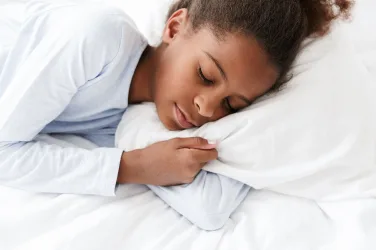 Image of peaceful african american little girl sleeping in bed at home - Why Sleep Is So Important for Kids