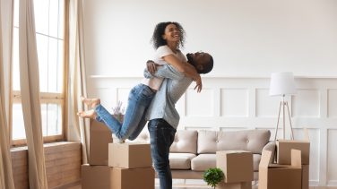 African husband lifting up wife happy family celebrating relocation daypeace of mind The Ins and Outs of Home Warranties