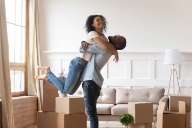 African husband lifting up wife happy family celebrating relocation daypeace of mind The Ins and Outs of Home Warranties