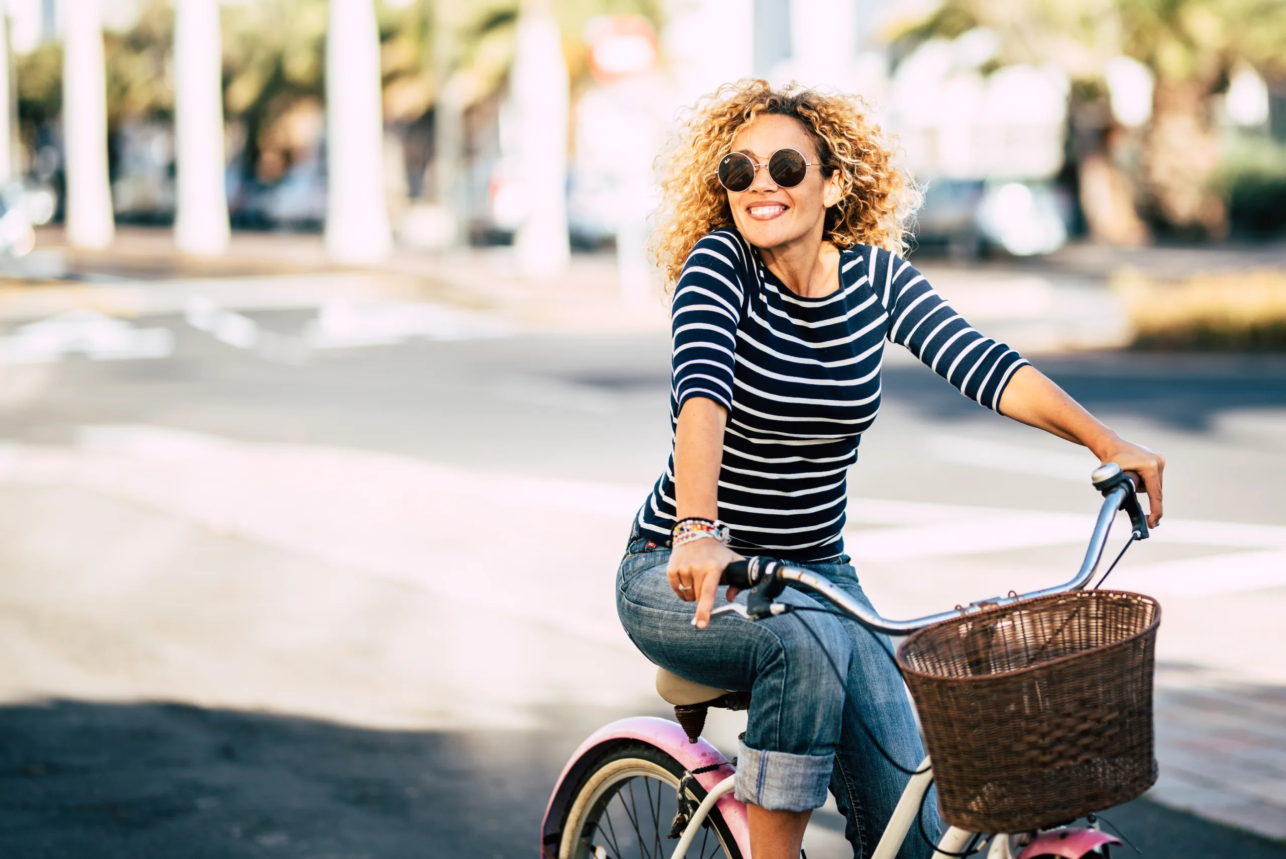 Beautiful and cheerful adult young woman enjoy bike ride in sun; gaining control 5 Lifestyle Changes to Help Combat Incontinence