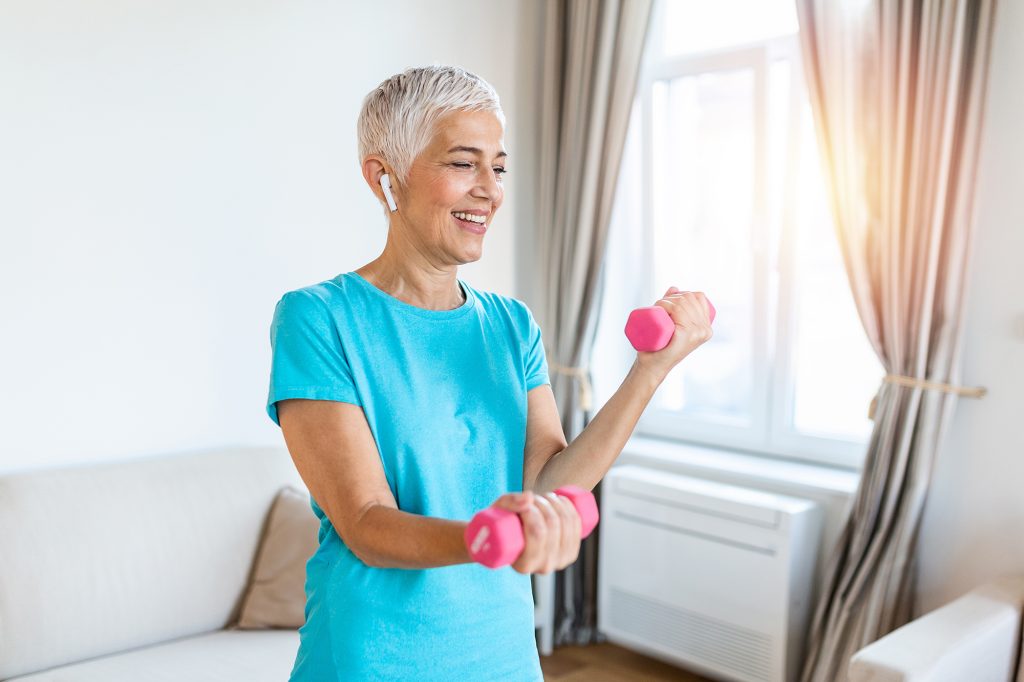 Senior woman exercise with dumbbells at home happy mature woman doing arm workout using dumbbells Elderly woman prefers healthy lifestyle How to Combat Age-Related Muscle Loss; Senior woman exercise with dumbbells at home happy mature woman doing arm workout using dumbbells Elderly woman prefers healthy lifestyle