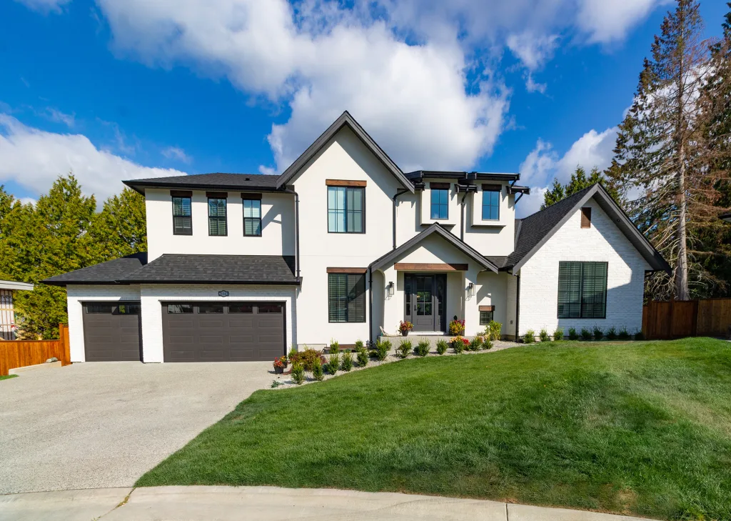 Wide Angle Shot of a Big white beautiful house in the suburbs Wide Angle Shot of a Big white beautiful house in the suburbs