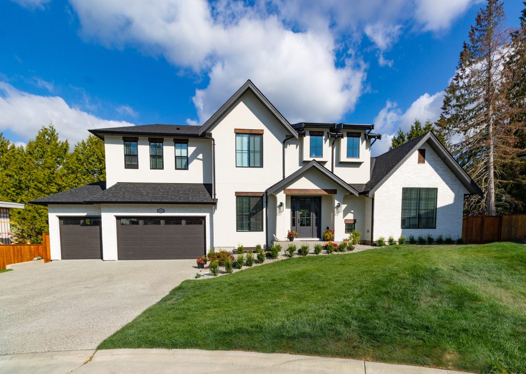 Wide Angle Shot of a Big white beautiful house in the suburbs Wide Angle Shot of a Big white beautiful house in the suburbs