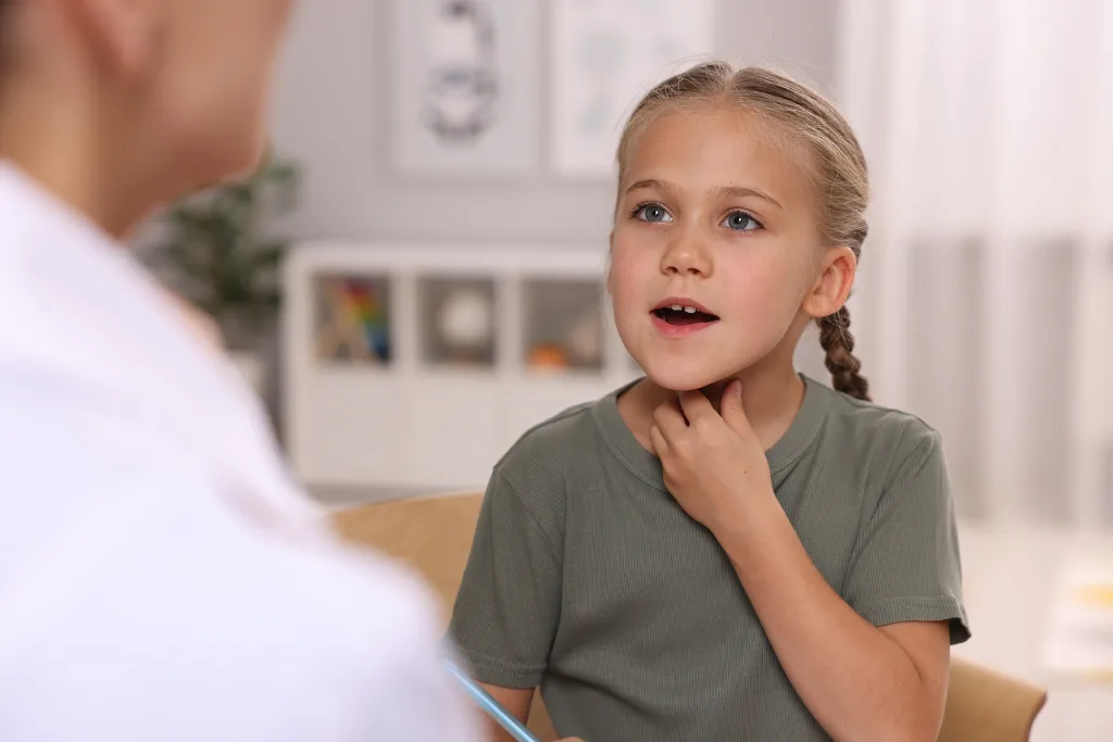 Dyslexia treatment Speech therapist working with girl in room