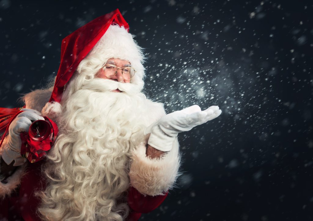 Santa,Claus,Blowing,Magic,Snow,Of,His,Hands