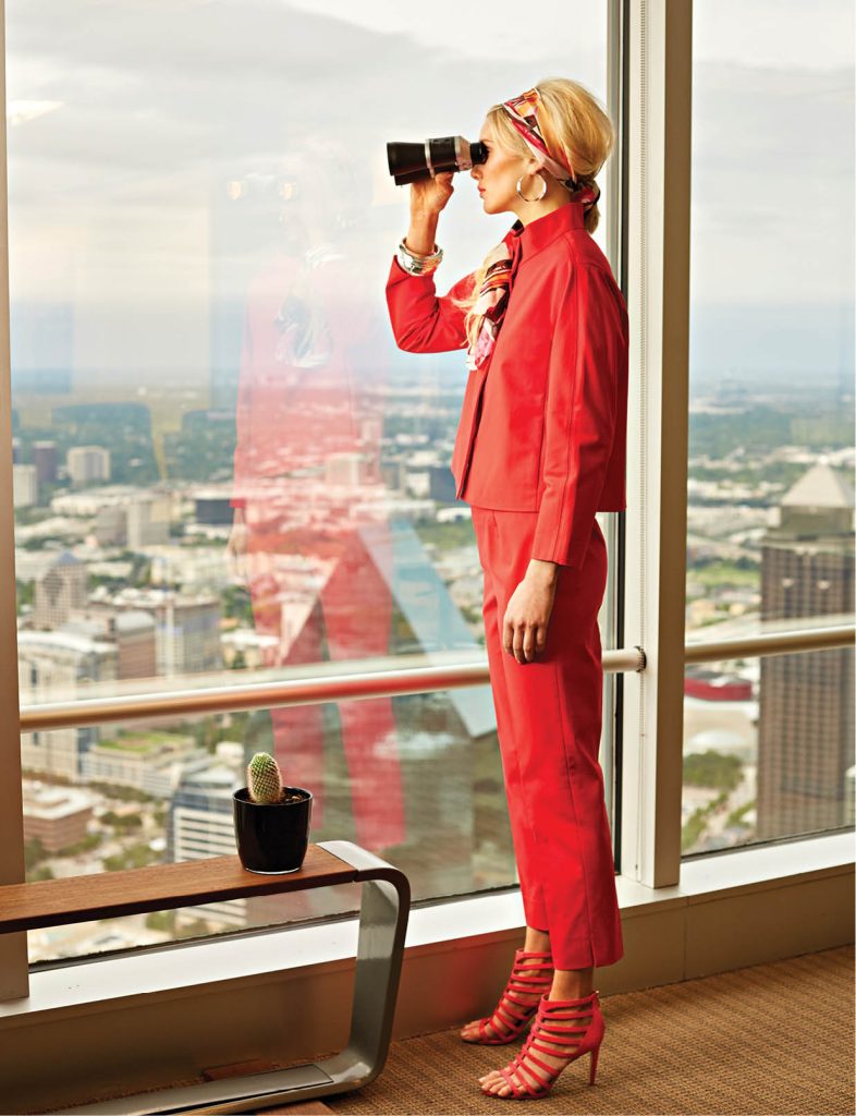 Lafayette jacket, $448 and pants, $278: Neiman Marcus. Vince Camuto scarf, $48, Robert Lee Moon earrings, $35 and Vince Camuto coral heels, $84: Dillard’s. Wide silver cuff, $34 and narrow silver cuffs, $32 each: Macy’s.