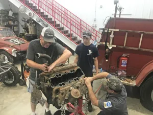 Chief Ted Stephens, Garrett & Ret. Chief Craig Zale completing engine disassembly prior to magnaflux testing.