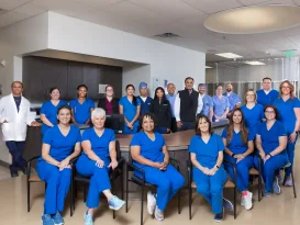 Digestive Health Center of North Richland Hills staff poses in blue scrubs for a group photo