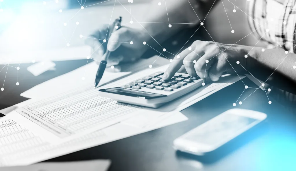 Female accountant using calculator; multiple exposure