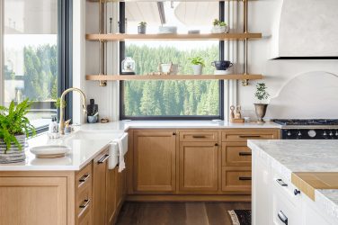 Traditional kitchen in new luxury home with hardwood floors, woo