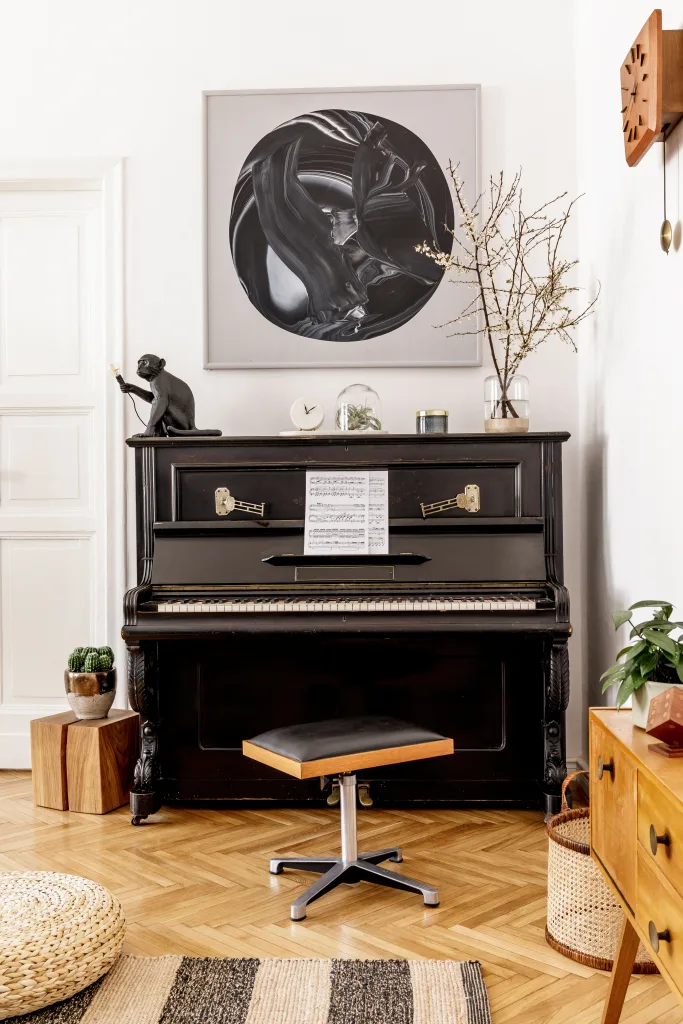 Stylish and cozy interior of living room with black piano, furniture, plant, wooden clock, lamp, mock up painitngs, carpet, decoration and elegant personal accessories in modern home decor Make Unused Rooms Functional Again
enhanced environment