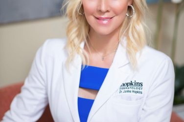 dr hopkins headshot with lab coat